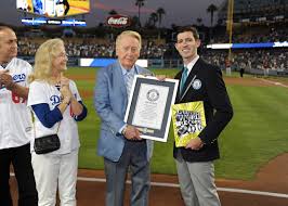 Vin Scully Receiving an award.  (http://m.mlb.com/cutfour/2015/09/24/151388192/vin- (MLB.com))